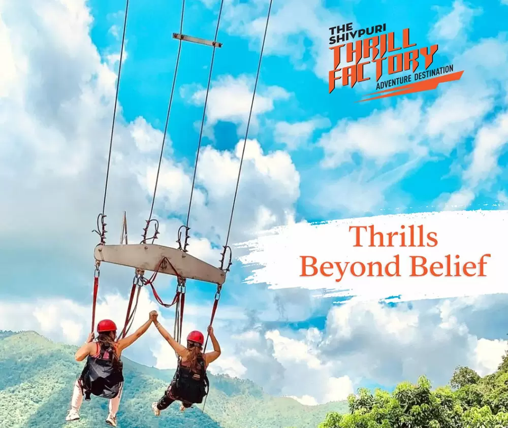 Thrill Factory giant swing above mountain valley